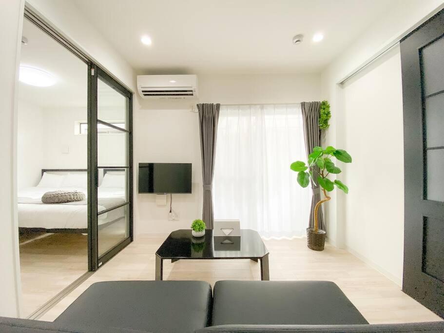 Residential Hotel Glitter Usjまで1駅5分 أوساكا الغرفة الصورة
