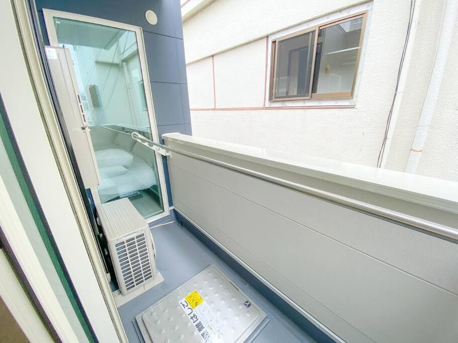 Residential Hotel Glitter Usjまで1駅5分 أوساكا الغرفة الصورة