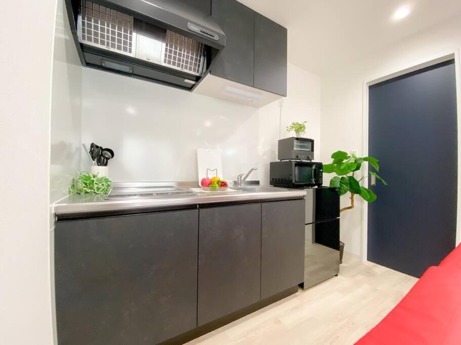 Residential Hotel Glitter Usjまで1駅5分 أوساكا الغرفة الصورة