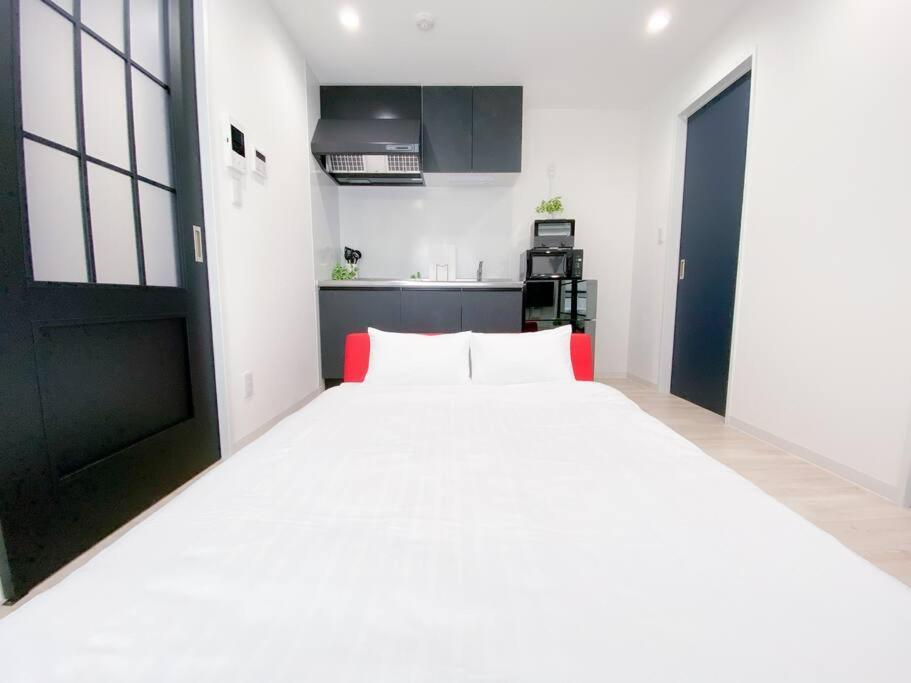 Residential Hotel Glitter Usjまで1駅5分 أوساكا الغرفة الصورة
