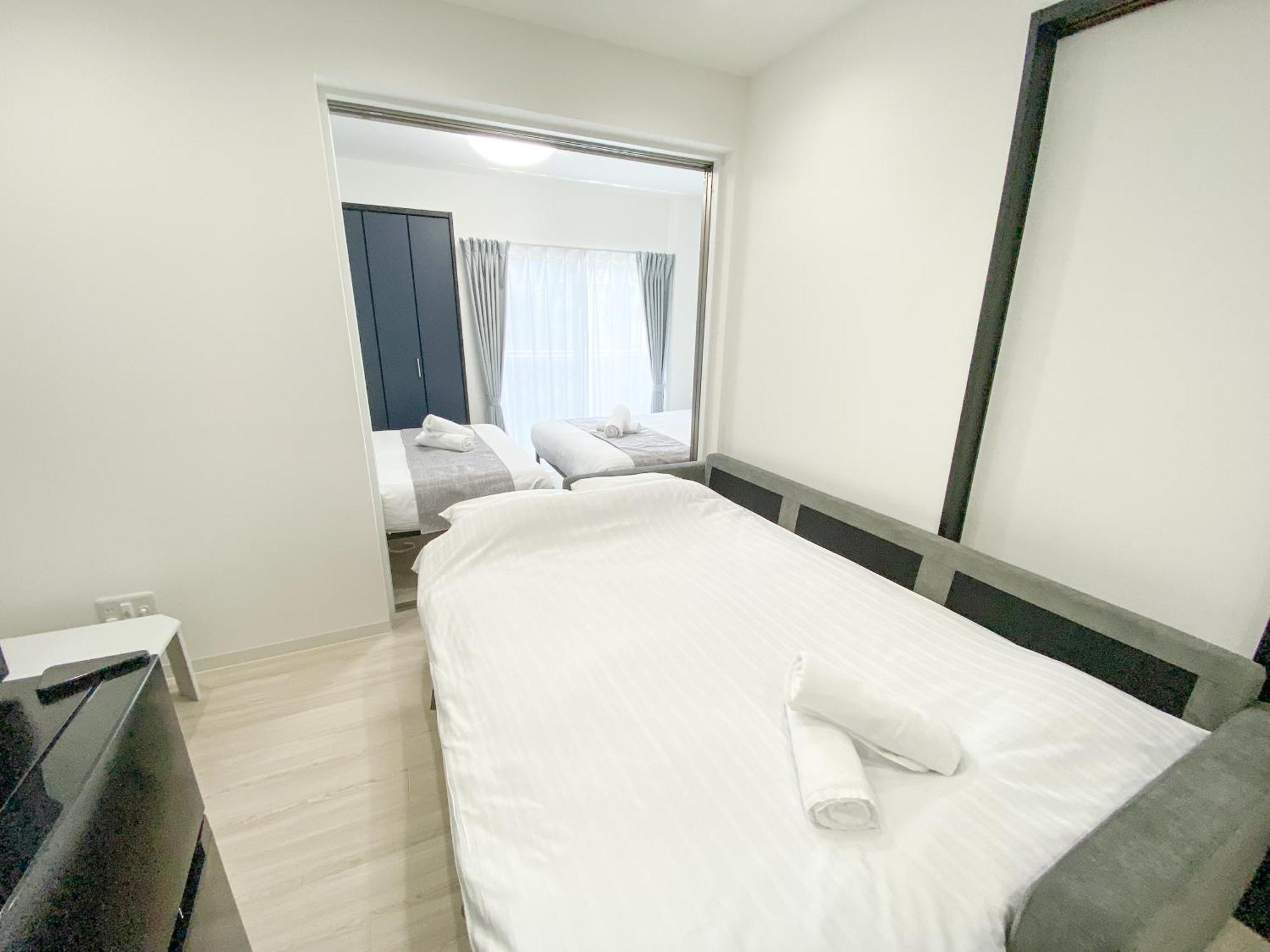 Residential Hotel Glitter Usjまで1駅5分 أوساكا الغرفة الصورة
